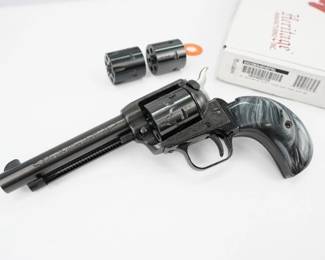 The Heritage MFG Rough Rider is a versatile and reliable single-action revolver renowned for its classic design and exceptional craftsmanship. Chambered in .22 LR, this firearm features a 6-round capacity and a 4.75-inch barrel, delivering precision and accuracy. Its alloy frame and cocobolo grips contribute to a balanced and comfortable shooting experience. Comes with 2 Additional cylinders, Original box and custom grips.. This revolver is in excellent condition showing normal signs of use and wear.
