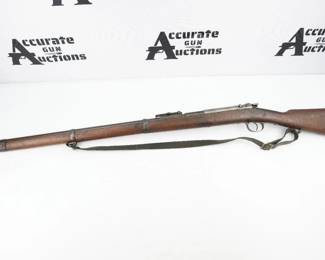 The Mauser Model 1871 adopted as the Gewehr 71 or Infanterie-Gewehr 71, or "Infantry Rifle 71" was the first rifle model in a distinguished line designed and manufactured by Paul Mauser and Wilhelm Mauser of the Mauser company and later mass-produced at Spandau arsenal. This rifle is outfitted with a sling and is in very good condition, showing obvious signs of use and wear. 