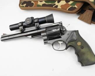 The Ruger Redhawk 44 Rem Mag features dual chambering for .44 magnum models, which also accept factory .44 special cartridges. The rugged stainless steel construction with no side plates, is designed specifically to handle powerful magnum loads through extra metal in top strap, sidewalls and barrel mounting, while the cold hammer-forged sleeve and shroud barrel provides outstanding accuracy. Triple-locking cylinder is locked into the frame at the front, rear and bottom for more positive alignment and dependable operation shot after shot. Single-spring mechanism allows for a smooth, light trigger pull. Easy sighting with readily replaceable, insert front blade sight and adjustable rear sight with white outline. Patented transfer bar mechanism provides an unparalleled measure of security against accidental discharge. The revolver is in excellent condition, showing minimal signs of use and wear.