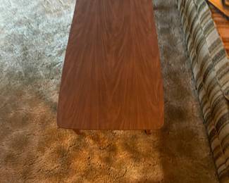 Very nice Mid Century Modern coffee table, surfboard styled. 