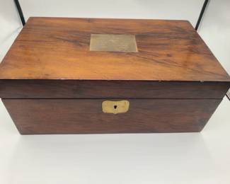 Box opens up to a writing desk w/hidden compartments