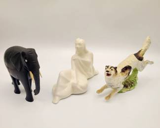 •Solid wood elephant
•Reclining Samoan woman designed by Dorr Bothwell
•Handpainted terrier dog figurine - made in Japan 