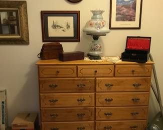 large dresser, lamps, artwork