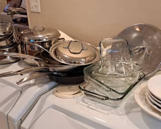 Complete set of stainless steel pots and pans, plus ornate dish set
