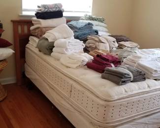 Towels, pillows, table, headboard