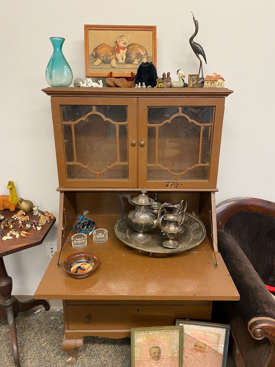 Drop front desk with glass door storage and lower storage drawers