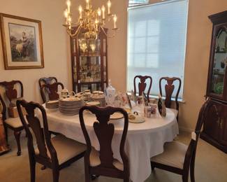 DINING ROOM TABLE AND 8 CHAIRS, PLUS 2 ADDITIONAL LEAVES.  COMES WITH CUSTOM TABLE PADS TO PROTECT FINISH