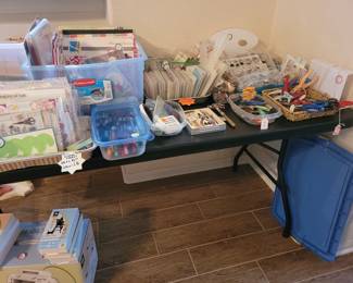 MORE PAPER CRAFTING SUPPLIES (ACRYLIC STAMPS,  SPECIAL SISSORS, COLORING MARKERS, TABLE OF DECORATIVE STOCK PAPERS AND MORE)