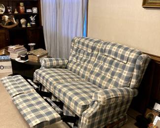 Reclining loveseat measures 54" x 32" x 35".