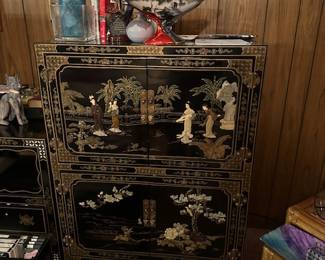 Black lacquer Chinese cabinet with inlay.