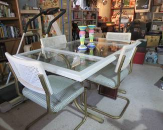 Glass table top with four chairs