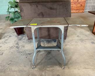 Antique typing table shown with extensions out