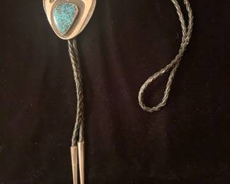 Item # 32 Unsigned sterling and natural Number Eight turquoise bear paw bolo, 3" x 2" 1.8 oz bolo, ca 1970, $300
