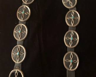 Item # 29 Sterling and turquoise concho belt, unsigned, having 10 conchos plus buckle on a black leather belt, 32", $700