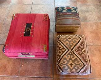 Item #68A Handwoven textile ottoman, red 27" x 23" $125; 68B Kilim ottoman in front, 21" x 17", $95; 68C Kilim ottoman in back, 15" x 15", $45