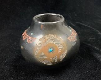 Item # 17 Juan Tafoya (San Ildefonso 1949-2006) 3 1/2" H blackware avanyu pot with sgraffito and turquoise, $250