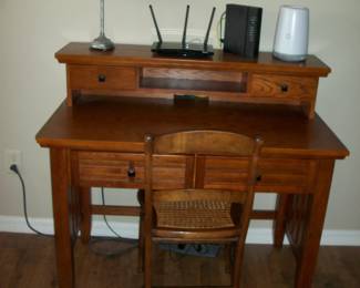 Wood 4 Drawer Desk with Cane seat chair ; Vanity Lamp.