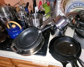Pots and pans - most new. Name brand: Lodge, Le Creuset, All-Clad, Cuisinart, William Sonoma, Revere