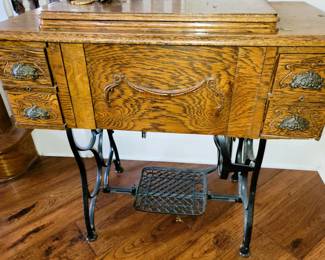 Antique tiger oak sewing cabinet with machine