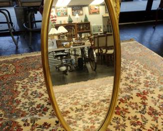 Large round oval mirror.