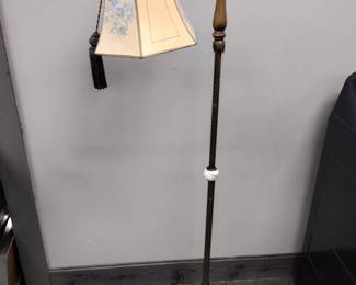 Antique lamp with slag glass ball.