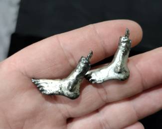 Craziest pair of Cufflinks. hacked off foot.