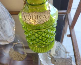 Green decanter. and liquor badges.