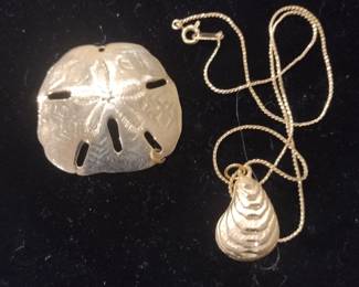Sand dollar pendant. An oyster shell necklace.