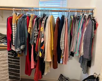 Lots of beautiful ladies clothes (some never worn and still bearing the store tags)