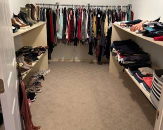 Ladies clothes (some with store tags still attached), bras, sports bras, shoes, boots, etc