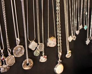 Lots of silver jewelry! There are necklaces, rings, earrings.