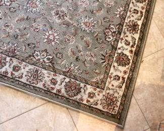 Green and floral area rug