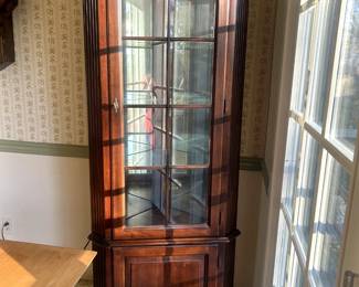 Mahogany Corner Cabinet 67" tall x 23" W. Perfect condition, gradual light, it works. $500