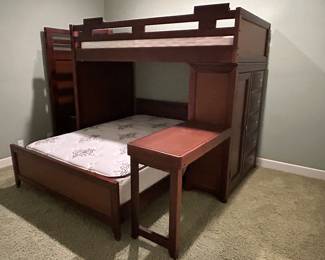 Bunk beds with wardrobe, dresser, desk , twin and double plush Circadian mattresses and additional storage under the stairs.  Must see. 