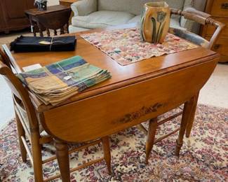 Drop leaf table, two of the four Hitchcock chairs