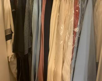 Closet packed with vintage mens clothing and shoes including high end suits