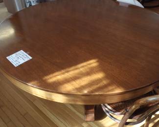 Wonderful 60inch Antique mahogany table with 6 leaves makes a long oval 11 feet long. Or any size in between.