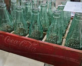 COCA COLA CRATE AND GLASS BOTTLES