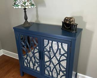 Mirrored Front Cabinet with Bronze Lion Statue and Stained Glass Floral Lamp