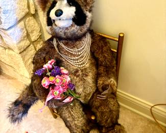 Humorous Toy Racoon on Chair