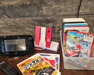 Nintendo Wii base unit,  panorama,  controllers, and DVDs