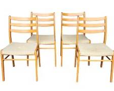 Four Danish Modern MCM Mid Century Modern Wood and textile covered seat Dining Chairs
