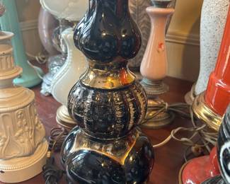 This is a 1950s ceramic table lamp in black and gold , attributed to having been made in Japan