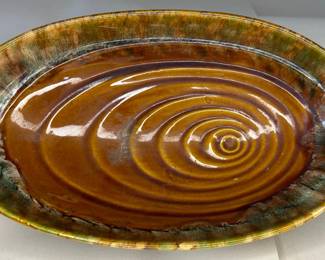 Vintage 1970s Brown Ceramic, Glaze Pottery With Oblong Design In Oval Serving Bowl/ Dish, Unsigned, Circa 1970s
Dimensions: 12.5" Length x 7.5" Width x 3" Height
This piece was purchased new in the 1960s and remained with the original owner. She is downsizing and is now available for purchase.
Disclosures: This set is in excellent condition with normal signs of wear for a piece this age. (Please see the pictures for details.)