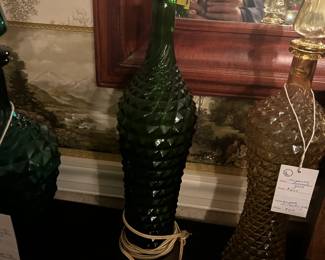 Vintage 1960's Empoli Glass Bottle Lamp "BELLA"Vintage from the 1960s
Materials: Glass, metal
Width: 47 centimeters
Height: 12 centimeters
Depth: 12 centimeters