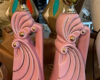 This is a pair of 1950s pink ceramic abstract lamps with gold accents