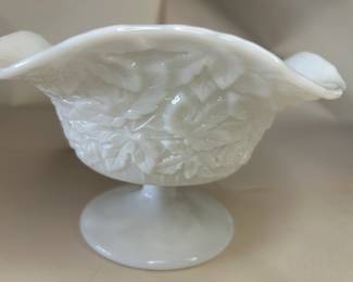 Vintage Westmoreland White Glass Maple Leaf Bramble Pedestal Bowl
Dimensions: 4.5" Height x 7" Top Circumference x 3.5" Bottom Circumference
This bowl was purchased new and remained with the original owner. She is downsizing and is now available for purchase.
Disclosures: This set is in excellent condition with no chips or signs of wear. (Please see the pictures for details.)
Background Westmoreland Glass:
Westmoreland's Milk Glass, made by Westmoreland in the 1920s, was the most remarkable and prolific product this company manufactured. According to the Collector's Encyclopedia of Milk Glass by Betty and Bill Newbound, they were one of the top producers of fine-quality milk glass in the United States. This includes the ever-popular hen-on-nest-covered dishes, first made of more delicate milk glass than the examples produced in the 1940s.