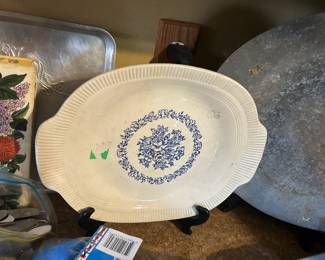 This is a 1930s to 1940s American made oval platter with a blue transferware floral design