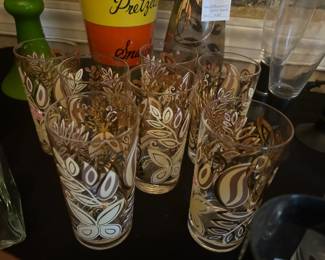 Mid-Century Tom Collins glasses are wrapped with a mid-century design of leaves and butterflies and come as an original set 7.
All glasses are in excellent vintage/used condition, with no chips or cracks in the glass. We recommend hand washing to retain the remaining decoration.
Each glass measures approx. 6 3/4" tall x 2 3/4" in diameter (at the rim) x 2" in diameter (at the base) and holds 12 fl. oz.