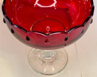 Vintage 1950s Pedestal Ruby Red Teardrop Glass Bowl
The 1950s Ruby Red Indiana Glass ~ Teardrop Compote Dessert Pedestal Bowl. This bowl has beautiful details, a scalloped rim, and a teardrop design. There are no chips or cracks. The ruby red color wasn't baked into the glass; they found it cheaper to apply the paint, so the inside is a delicate surface. With small imperfections, this is a beautiful bowl to display as a centerpiece in your home.
This dish was purchased new in the 1950s and remained with the original owner. She is downsizing and is now available for purchase.
Disclosures: This case is in good condition with signs of wear, including fading of the red inside the bowl. There are NO chips or scratches in the glass. See pictures for details.
Dimensions: 7.5" Height x 7.5" Top Circumference x 4.5" Bottom Circumference